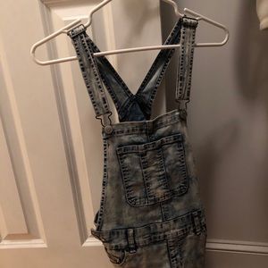 Overall shorts. Light distressed wash.